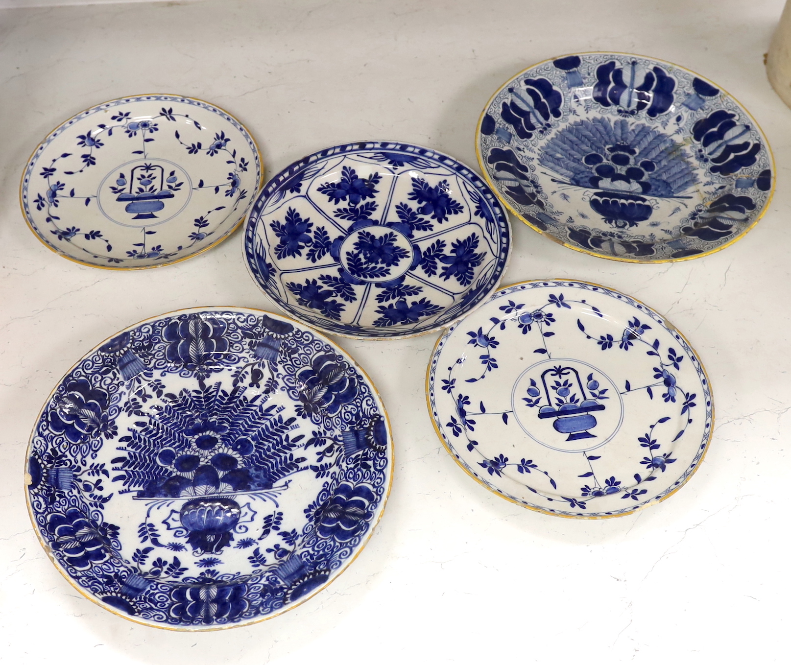 Five 18th century Delft blue and white plates, largest 31cm